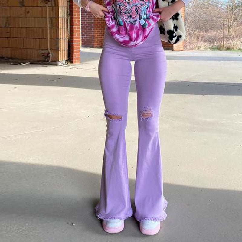 “Stretch Denim Trousers in Vibrant Colors with Ripped, Frayed, and Flared Details”