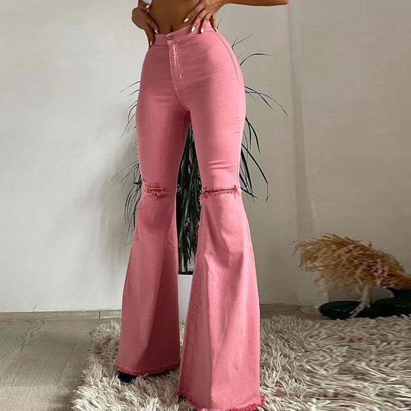 “Stretch Denim Trousers in Vibrant Colors with Ripped, Frayed, and Flared Details”