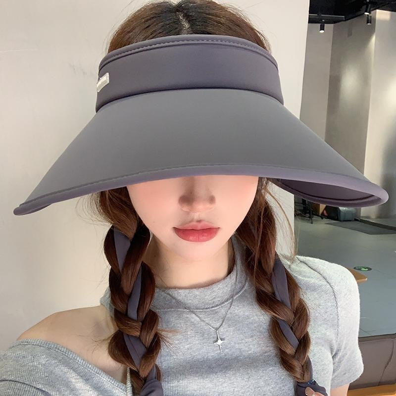 Foldable UV hat for women displayed on a white background.