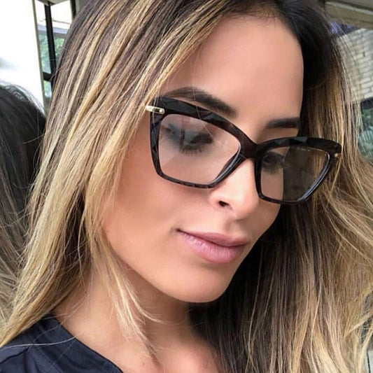 Cat eye anti-blue light glasses with multi-faceted frames on display.