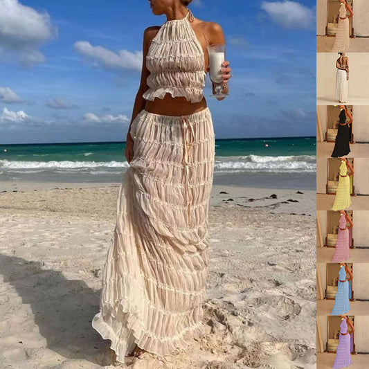 "2-piece women's dress suit with halter top & pleated skirt. Perfect for summer & beachwear."