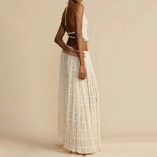 - "Women's 2-piece beach outfit with halter top & pleated skirt.
